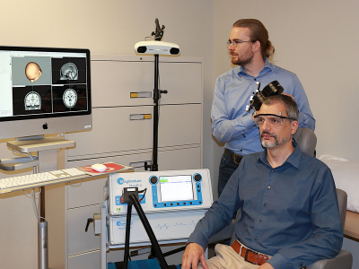 Angel Peterchev and lab mate demonstrate TMS with neuronavigator