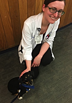 Resident Caitlin Tillberg with therapy dog