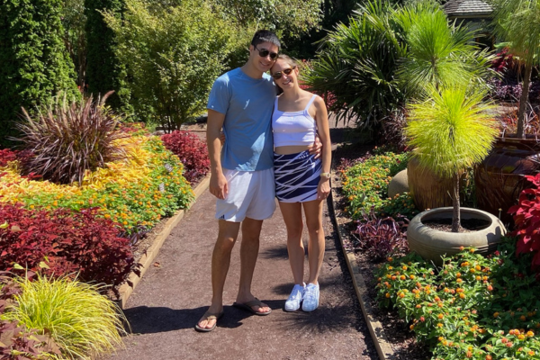 Lisette Corbin and her fiancee, Matt, standing on a gravel path in Sarah Duke Gardens