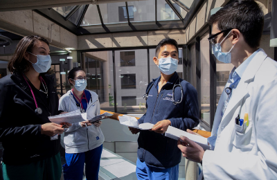 Four residents talking with each other in the hospital