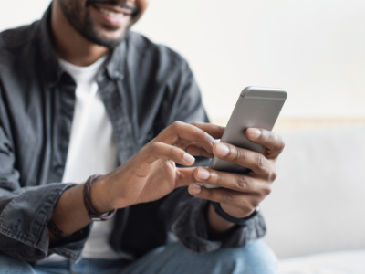 Man using cell phone - face only partially shown