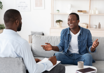 Therapy session with psychologist and young man