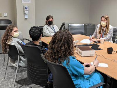 Residents participate in Academic Half-Day session led by Julie Penzner, MD (center) and Marla Wald, MD (top right).