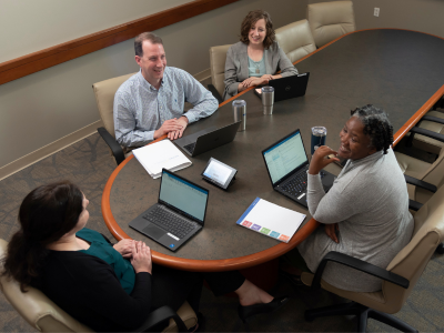 Members of the child trauma research team meet to discuss a project