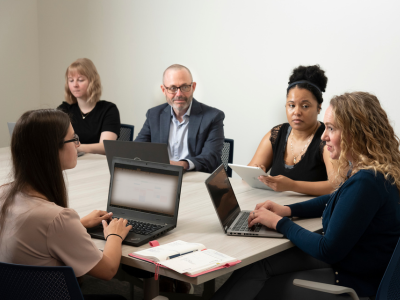 Duke Psychiatry smoking cessation researchers gather to discuss a study.