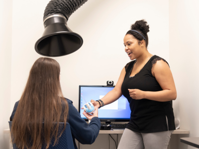 Duke Psychiatry staff member works with research participant in the smoking cessation lab (simulated)