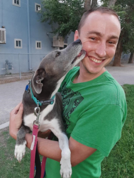 Alex Norton holding his dog Callie