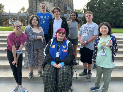 Eight teen/young adult 2024 Campference attendees pose in front of Duke Chapel