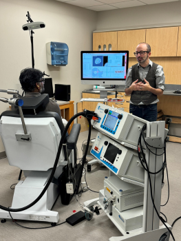 TMS faculty member Simon Davis, PhD, instructs a participant in the October 2024 course.