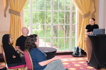 Maia Keller, senior clinical research specialist at the Duke Center for Autism and Brain Development, leads an educational session for theater staff in Fall 2024.