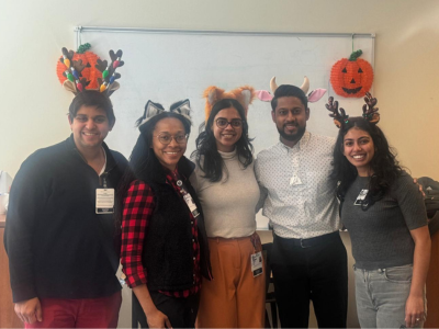 Five CAP fellows wearing decorative headbands for Halloween