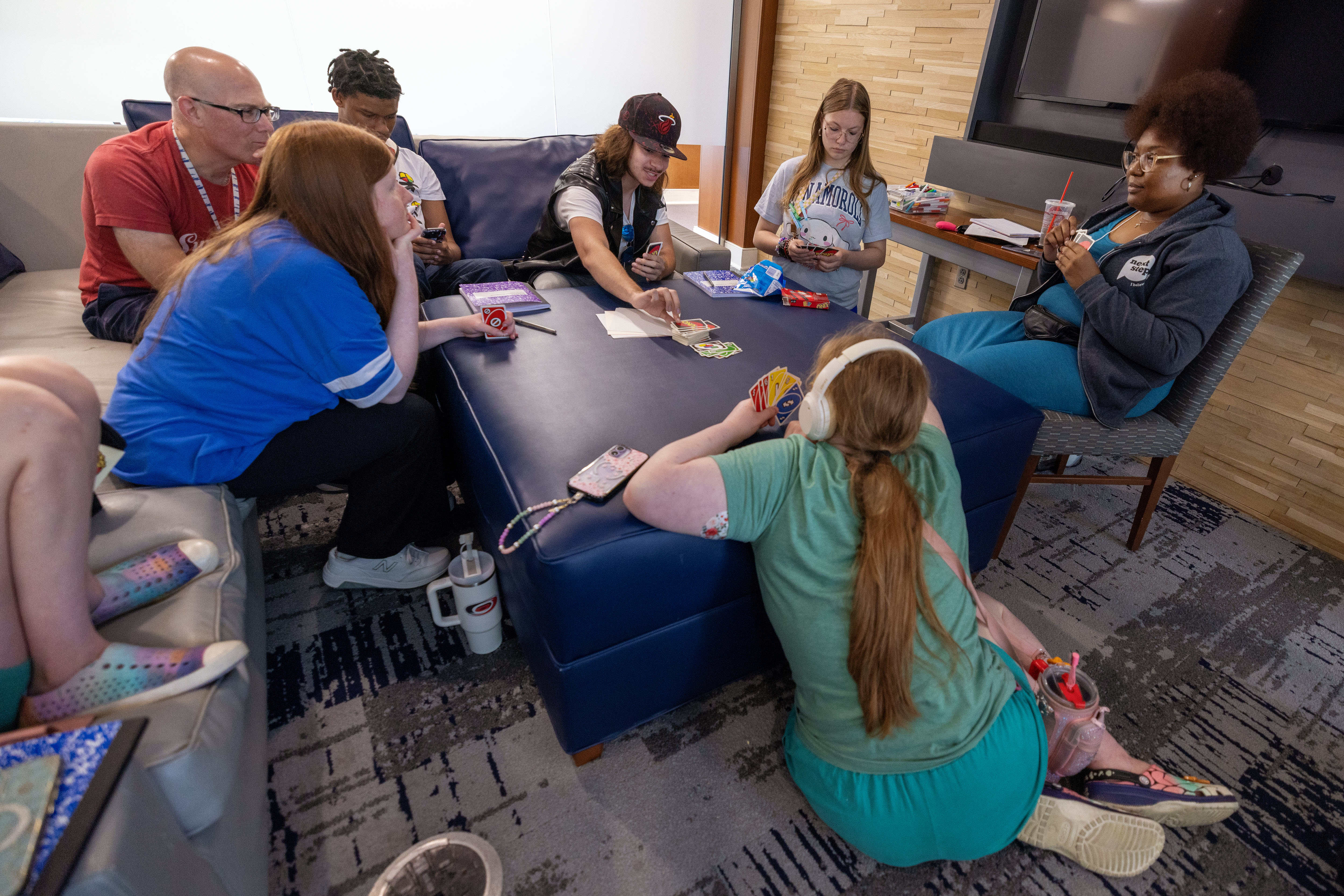 Group of young adults playing a card game
