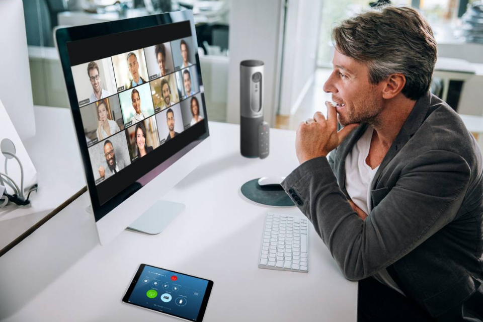 Man participating in Zoom meeting
