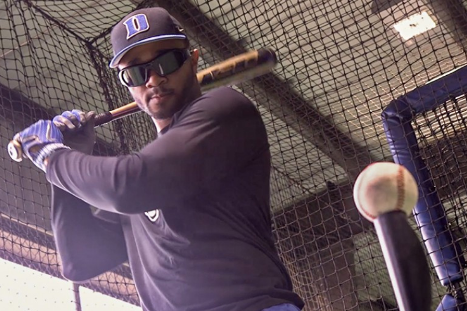 Baseball player batting from a tee