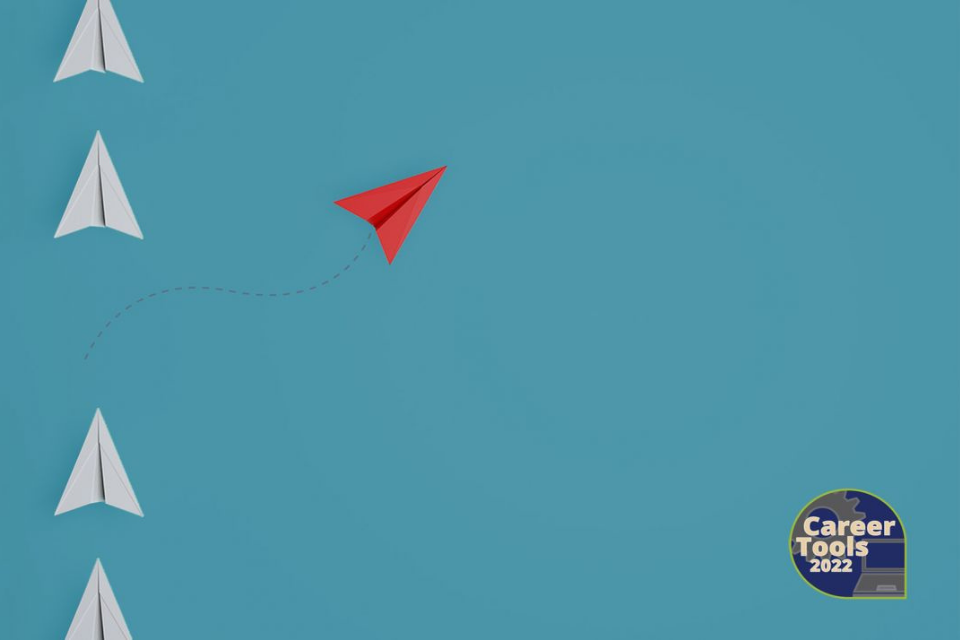 Red and white paper planes on a teal blue background