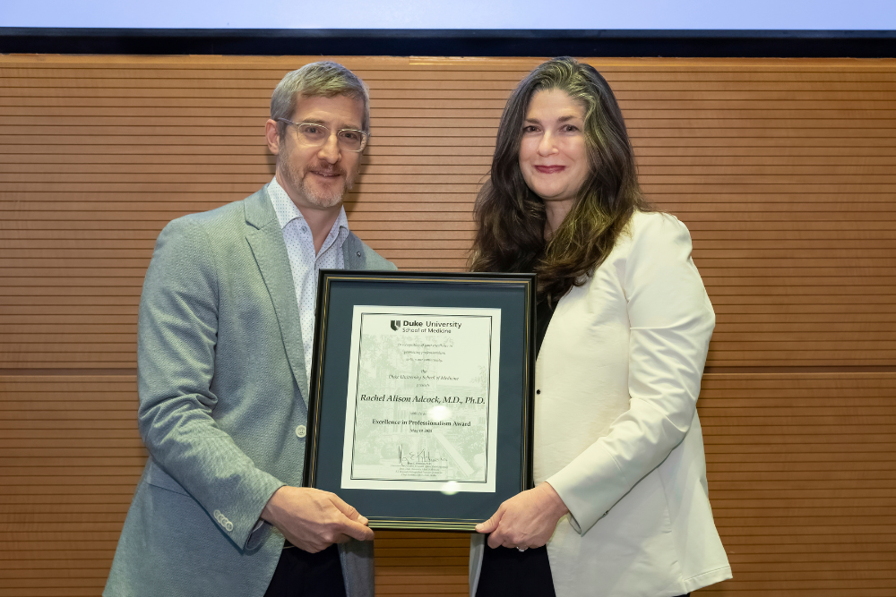 Jonathan Posner presents award to R. Alison Adcock
