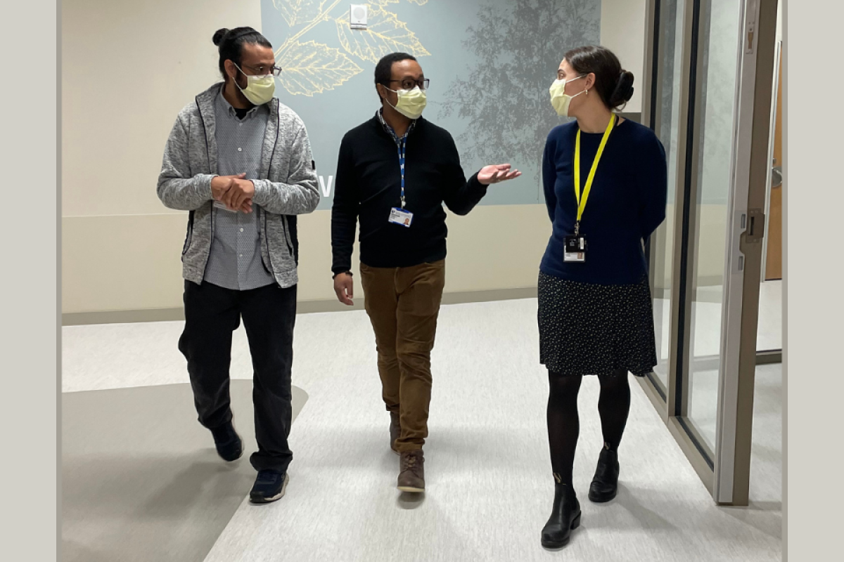 Mohammed Alsubaie, Jeremy Grove, and Julia Chafkin walking in the hallway of the inpatient unit at Duke Behavioral Health North Durham