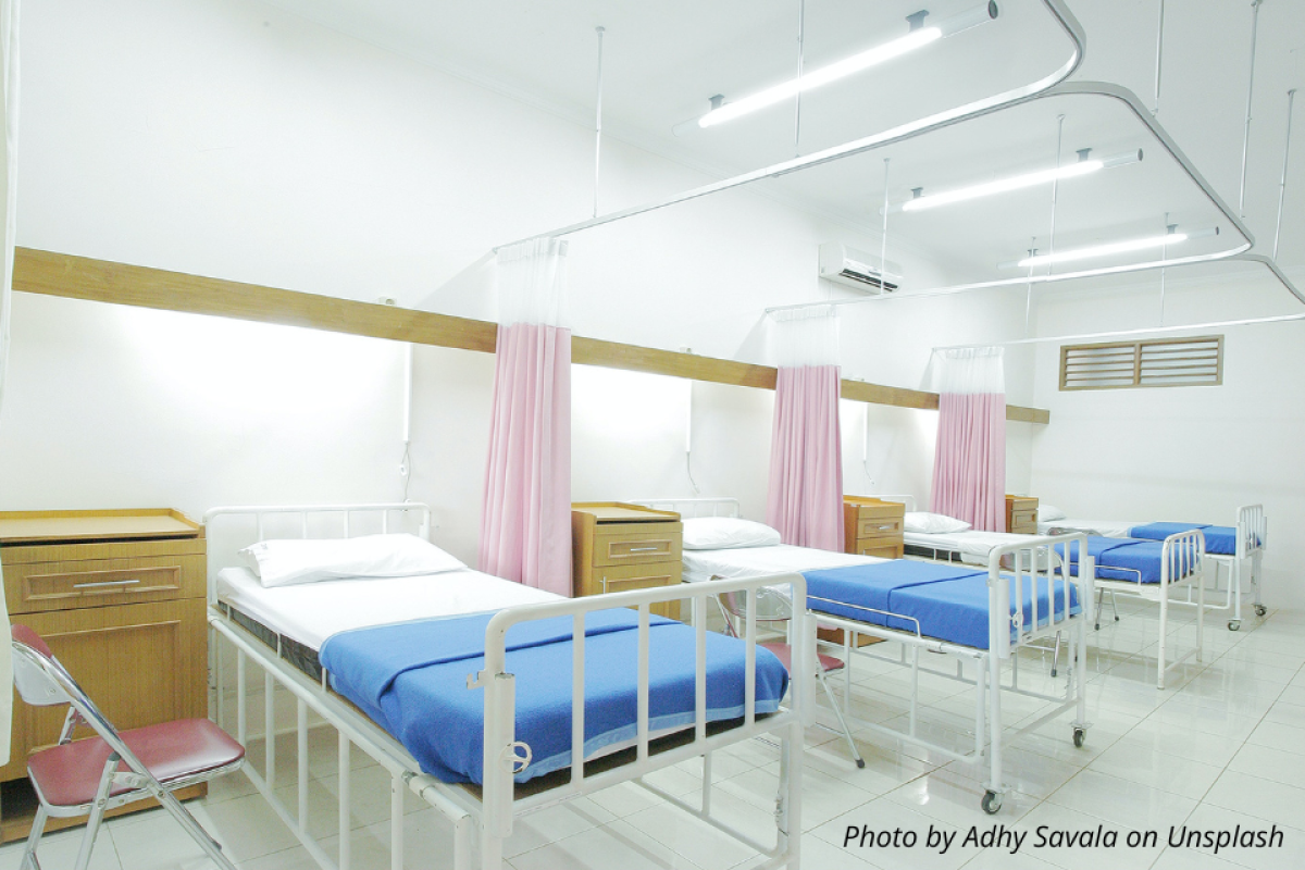 Three empty beds in an emergency department. Photo by Adhy Savala on Unsplash.  