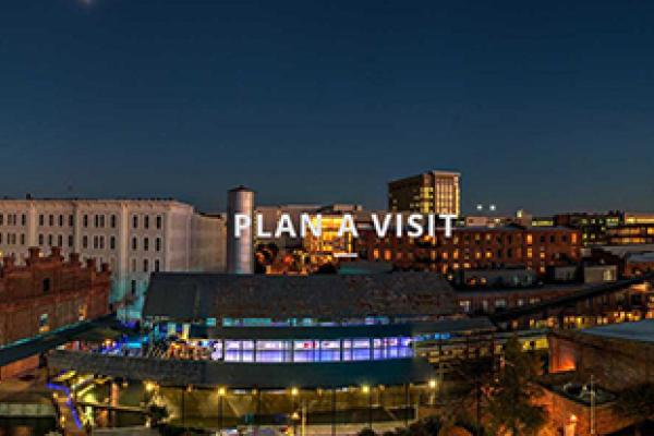 Durham skyline. Text: Plan a Visit