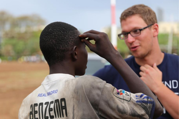 Rick Wolthusen talks with a friend in Kenya