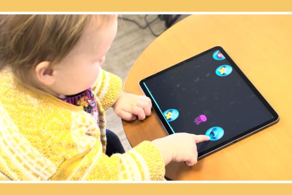Toddler playing a game on a tablet