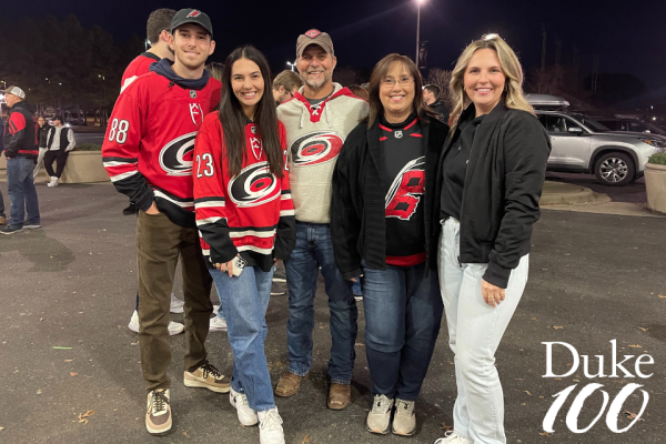 Cathy Lefebvre and her family at a Hurricanes game, decked out in Hurricanes garb