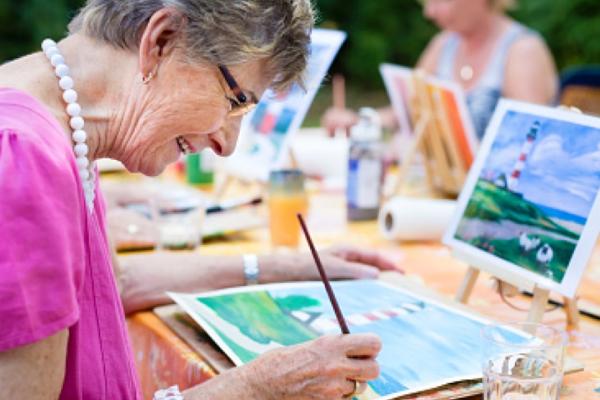 Older woman painting