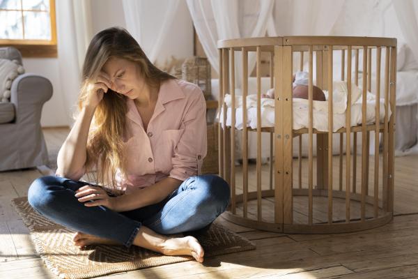tired mom newborn baby