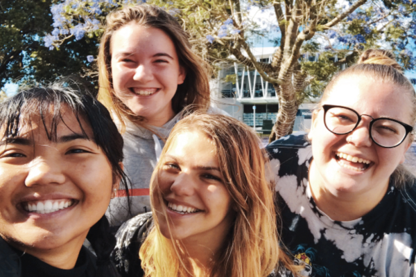 smiling adolescent girls outside