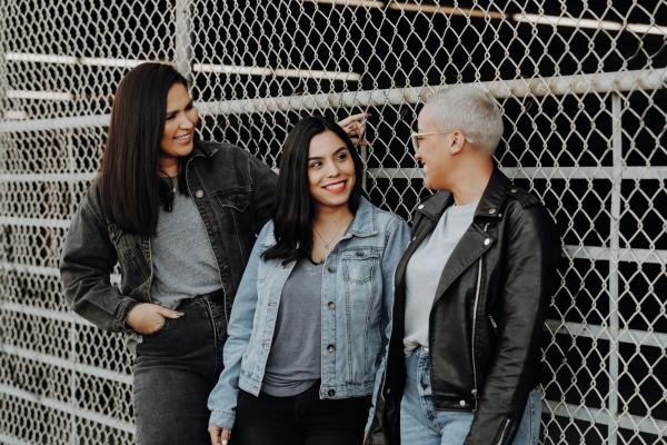 Young adult women outdoors smiling