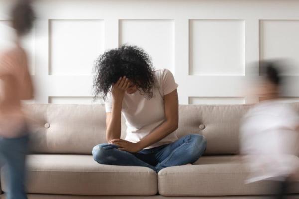 Sad Woman on Sofa