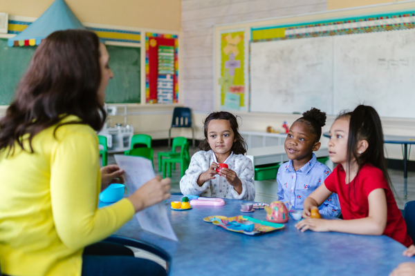 Pre-K girls with their teacher