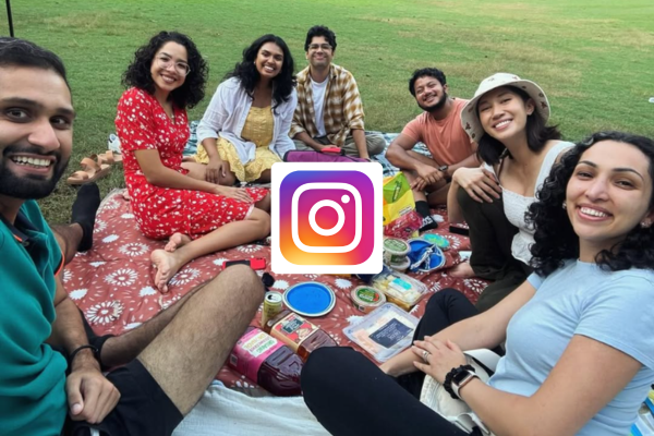Group of residents sharing a meal together at a park