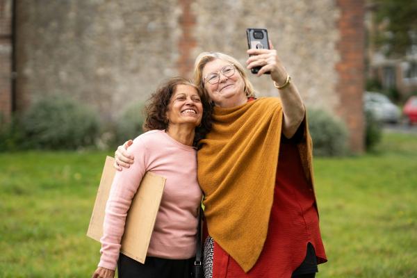 Two older women taking selfie