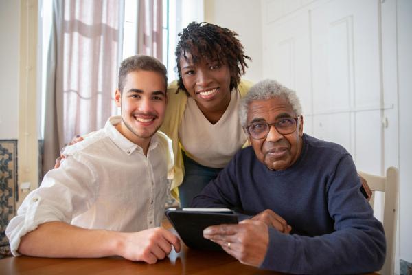 Three people with digital reader