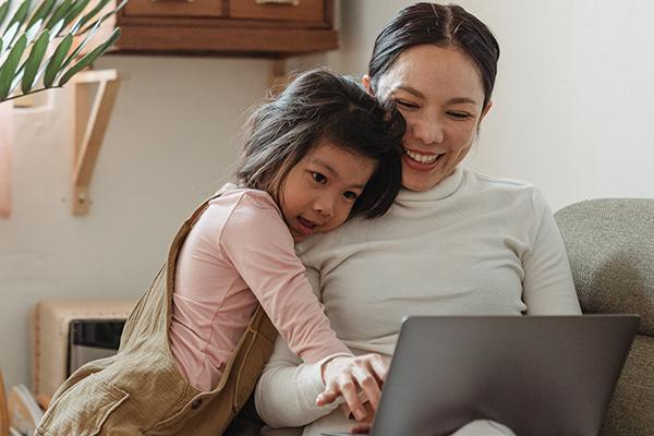 Mom and daughter at laptop