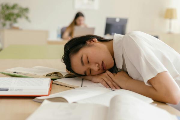 Girl sleeping on desk