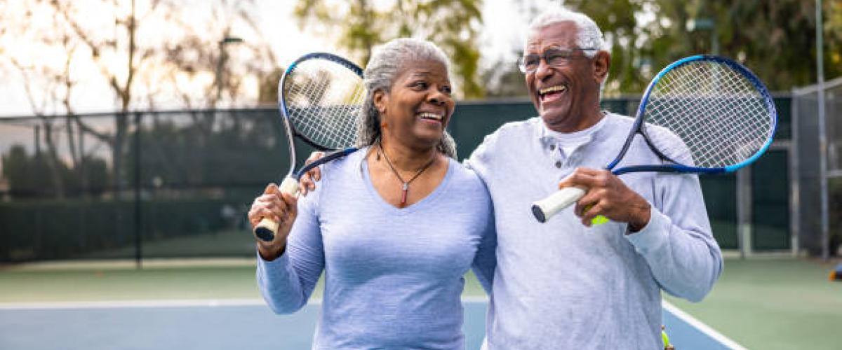 couple walking off tennis court