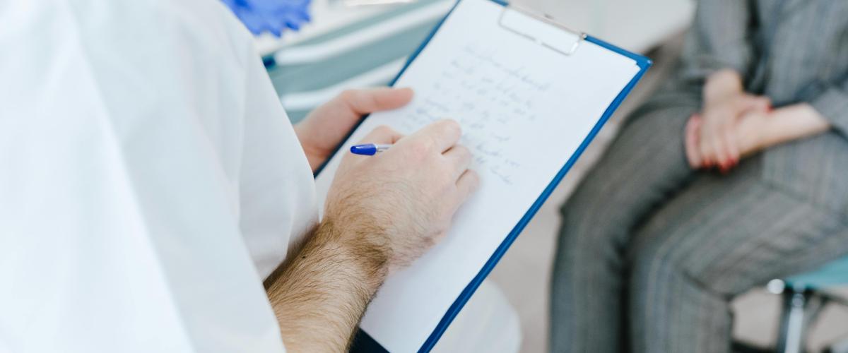 Researcher questioning patient