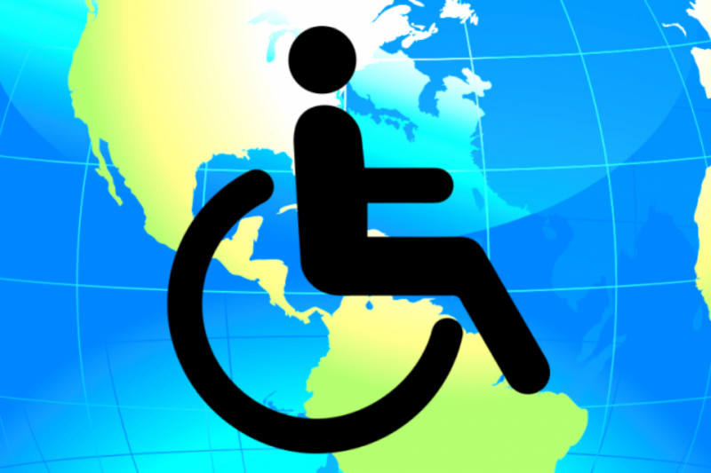 Wheelchair symbol overlaid on world map