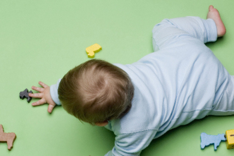 Baby crawling on floor