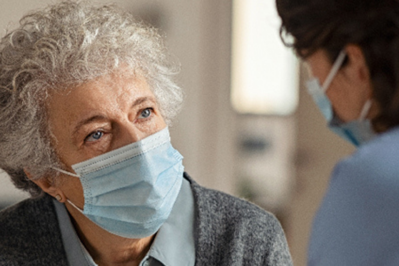 Provider speaking with an older adult patient