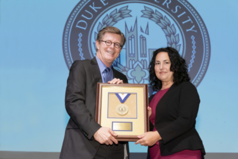 President Price and Nicole Heilbron as Dr. Heilbron accepts her award