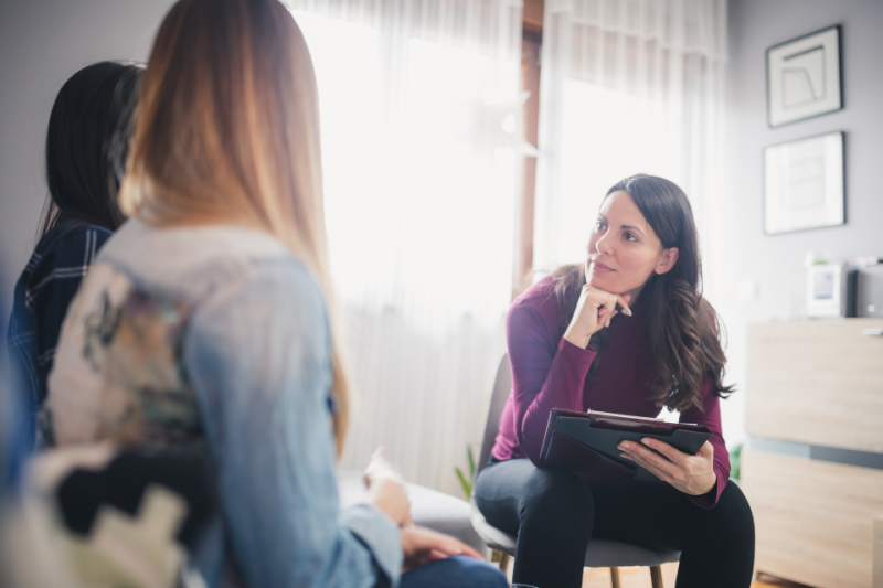 Therapy session with teen and parent