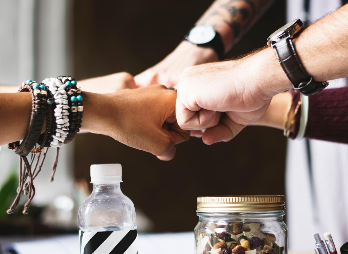 Friends bumping fists