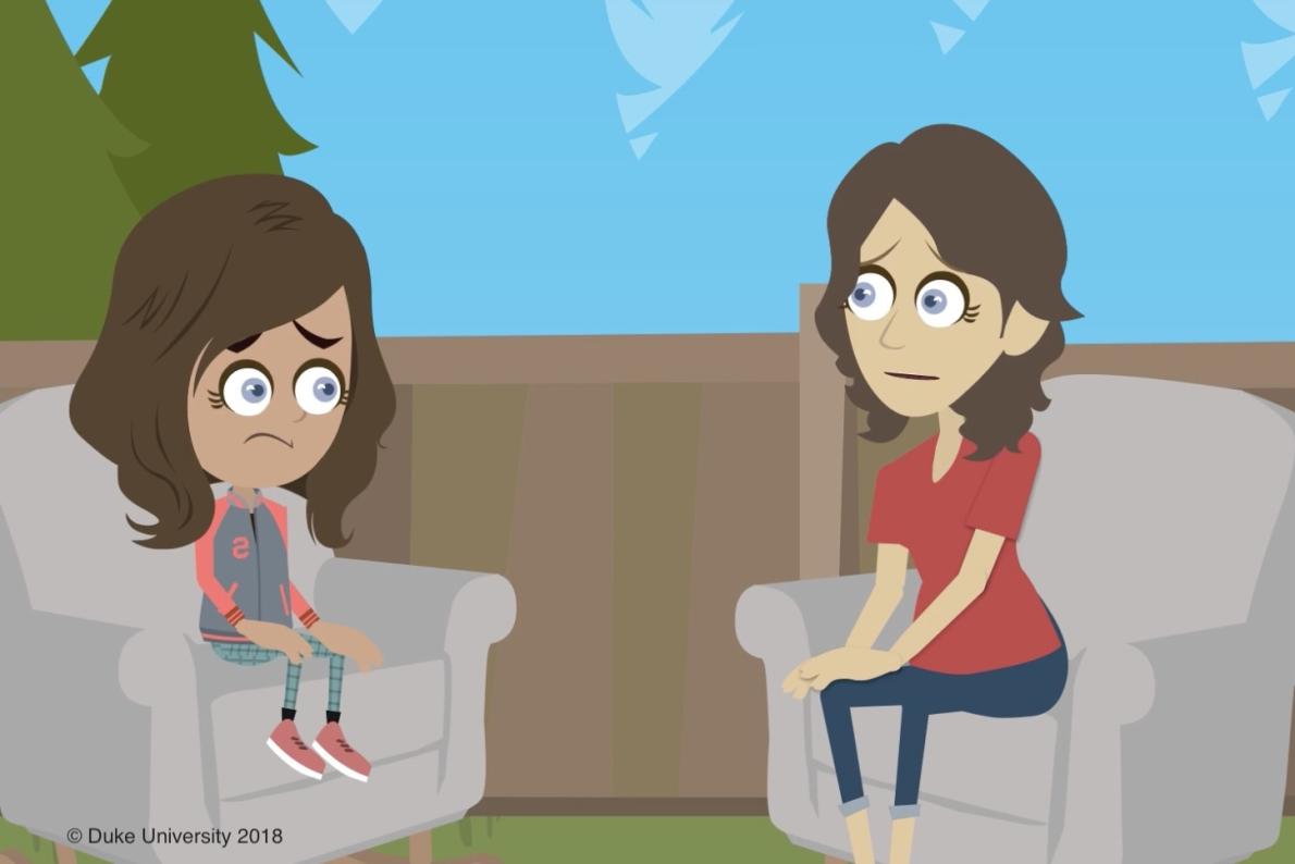 2 people sitting facing each other, the girl has a concerned face 