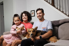 Cancer survivor Iris Bugbee with her husband, Greg, daughter Mila, and corgis, Candi and Charli, at her home in Fuquay Varina in 2024