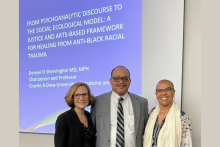 Moira Rynn, Jay Carter, and Denese Shervington in front of Dr. Shervington's title slide.