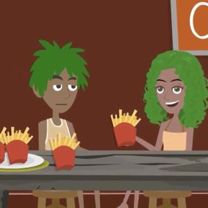 2 people in front of a table with french fries. 