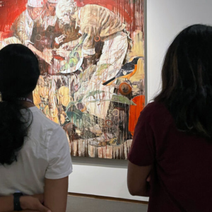 Students stand in front of the painting “Dr. Henry Bethune” by Hung Liu during a visit to the North Carolina Museum of Art. During a gallery tour led by Duke Medical Instructor John David Ike, students shared their emotional responses and tried to imagine the experiences of figures in the artworks.